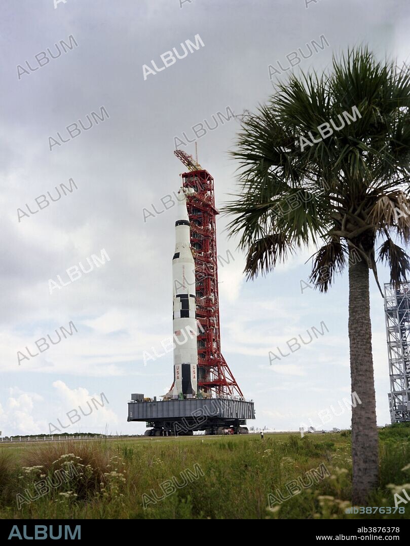 August 26, 1967 - The Apollo 4 (Spacecraft 017/Saturn 501) stack and its mobile launch tower atop a crawler-transporter moving from the Vehicle Assembly Building toward the launch pad.