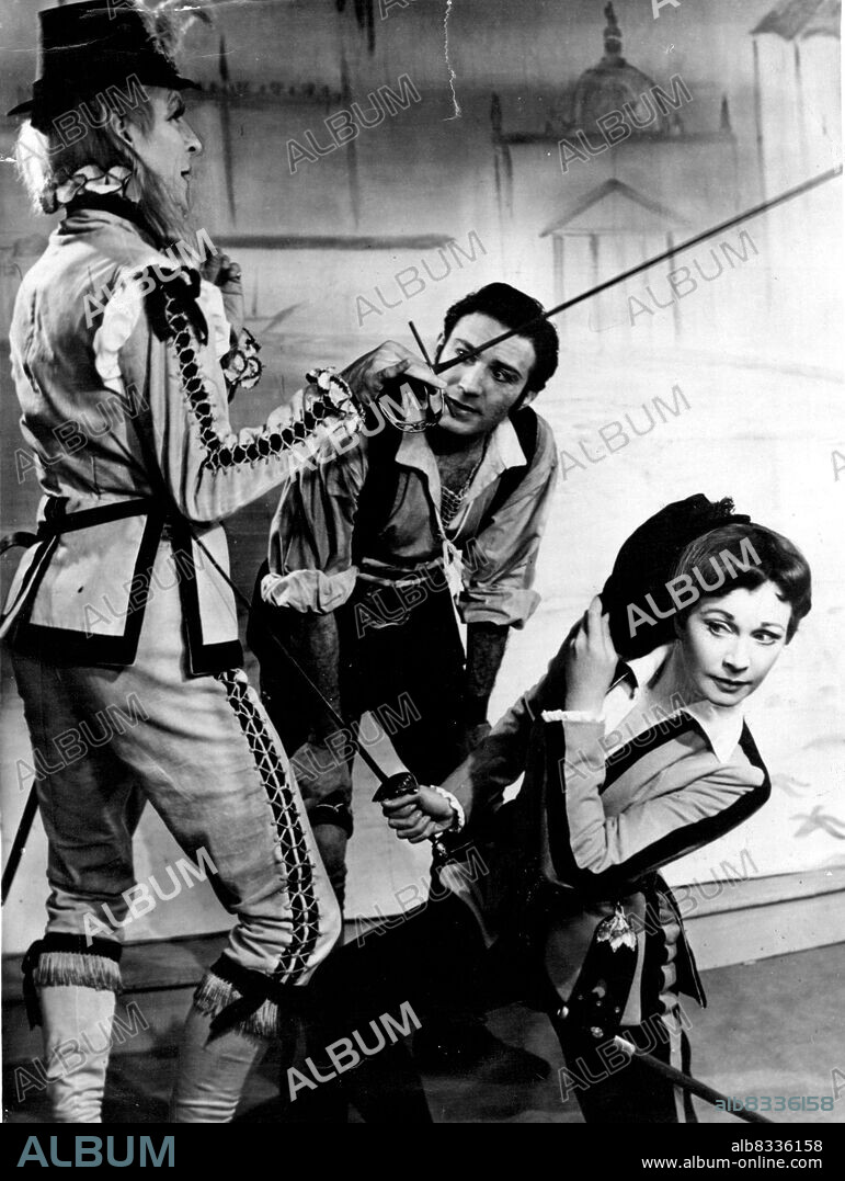 Viola (Vivien Leigh) evaes a thrust by Sir Andrew Aguechek (Michael Denison), left, while Fabin (Lee Montague) looks on during a rehearsal of "Twelfth Night" at Stratford. Sir Laurence Olivier and his wife, Vivien Leigh, are producing the pay for the 96th Shakespeare Memorial Festival. April 23, 1955.