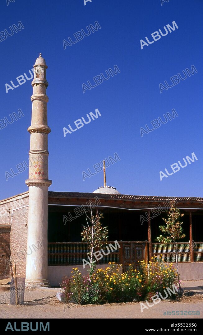 The Imam Asim Shrine and other tombs can be found 23 kilometres from Khotan (Hotan) on the southern Silk Road. It is the site of a huge pilgrimage each May. Imam Asim was one of the first Islamic missionaries to visit this area. Khotan traces its history back at least as far as the 3rd century BCE, when the eldest son of the Indian emperor Asoka is said to have settled here. It was of great importance on the Silk Road, and is claimed to have been the first place outside China to have cultivated silk. It sits astride the Karakash or ‘Black Jade’ and Yurungkash or ‘White Jade’ Rivers, which here conjoin to form the Khotan Darya, and has been famous for its jade for well over two millennia. In times past trade routes crossed the desert to the north all the way to Kuqa, and as recently as 2007 this link has been re-established for the first time in centuries with the opening of a second Desert Highway leading to Aksu, distant some 424km to the north. In 1006 Khotan was conquered by Uighur Muslims from Kashgar, and since that time the city remains a very Uighur place.