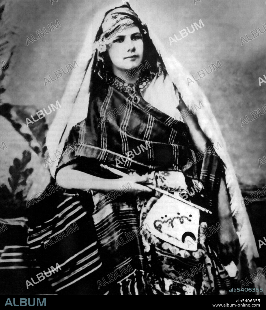 Editorial use only . Isabelle Wilhelmine Marie Eberhardt (1877-1904) was a Swiss explorer and writer. As a teenager she published short stories under a male pseudonym. She became interested in North Africa and, after an invitation from photographer Louis David, moved to Algeria in May 1897. There she dressed as a man and converted to Islam, eventually adopting the name Si Mahmoud Saadi. Her unorthodox behaviour made her an outcast to European settlers and the French administration. Eberhardt's acceptance by the Qadiriyya, an Islamic order, convinced the French administration that she was a spy or an agitator. She survived an assassination attempt shortly thereafter. In 1901 the French administration ordered her to leave Algeria, but she was allowed to return the following year after marrying her long-time partner, the Slimane Ehnni. In 1904, she was killed by a flash flood in Ain Sefra, at the age of 27. undated.