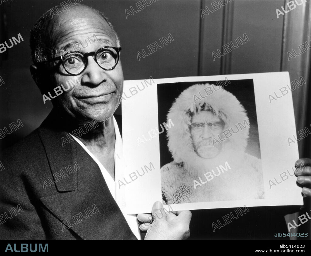 Henson holding a portrait of Peary taken during an expedition to the North Pole. Matthew Alexander Henson (August 8, 1866 - March 9, 1955) was an African-American explorer. He met Robert  Peary in 1887 and they made many trips, including Arctic voyages in which Henson traded with the Inuit, mastered their language, and trained dog teams. In 1909, Peary mounted his 8th attempt to reach the North Pole. He sent Henson on ahead as a scout. "I was in the lead that had overshot the mark a couple of miles. We went back then and I could see that my footprints were the first at the spot."  Although Peary received many honors, Henson was largely ignored.  World-Telegram photo by Roger Higgins, 1953.