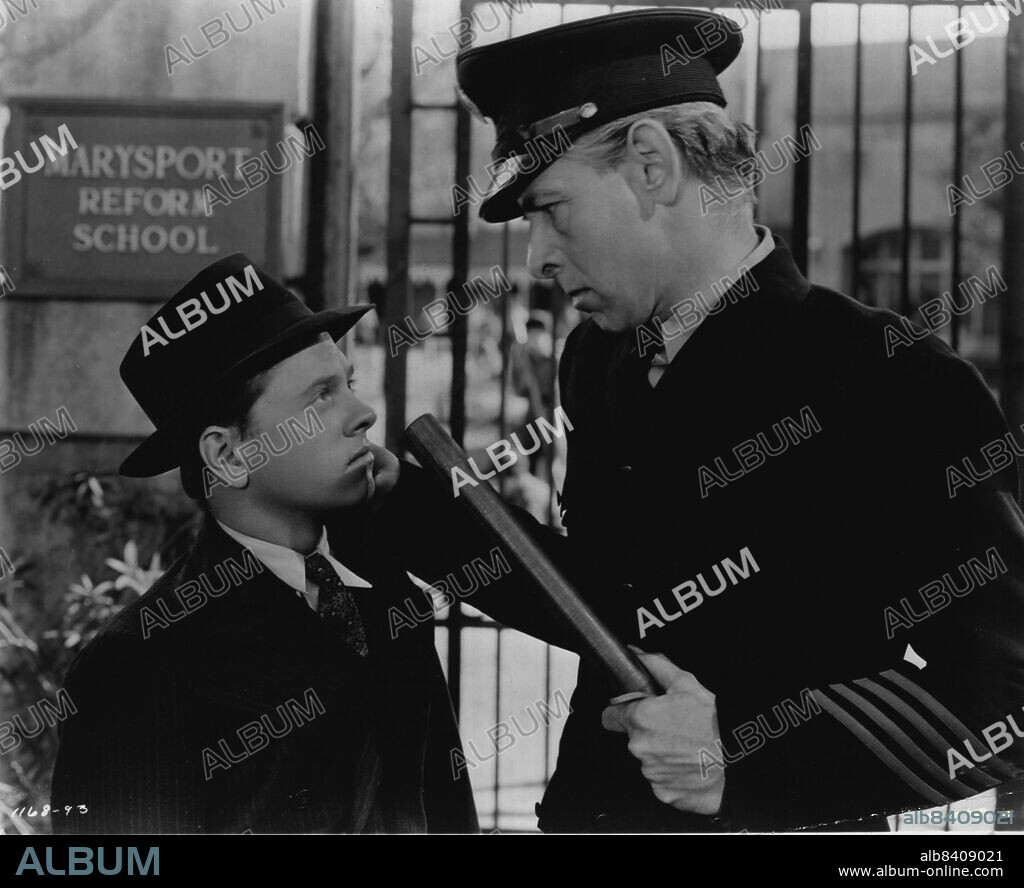 For The First Time In The Screen's History.... "Don't Come Back Any More"... Says the guard (Arthur Hohl) threatening Whitey, who has gone to the local reform school to see a boy he has heard about. Whitey, following the teaching of Father Flanagan, hopes to help the boy.Two stars repeat their Academy Award roles in "Men of Boys Town", Metro-Goldwyn-Mayer's sequel to the memorable "Boys Town" and again starring Spencer Tracy as Father Edward J. Flanagan and Mickey Rooney as Whitey Marsh, Mayor of Boys Town. Tracy won the Academy Award in 1938 for his characterization of Father Flanagan and Rooney was given special award for his performances in "Boys Town" and "Love Finds Andy Hardy," "Men of Boys Town" is actually not a sequel, but a new and dramatic story of Father Flanagan's fight for homeless, unwanted boys, to which he has devoted his life. November 04, 1947. (Photo by Metro Goldwyn Mayer Pictures).