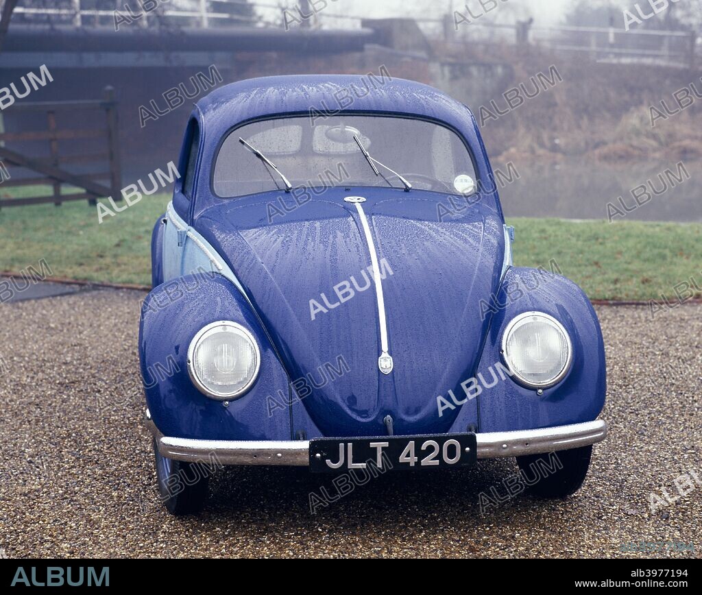A 1947 Volkswagen Beetle. Ferdinand Porsche produced ancestral KdF-wagen prototypes in 1935. Batches of pre-production versions followed, before manufacture began in 1939, adapted for military use. Adolf Hitler advised that the Volkswagen People's Car be streamlined to 'look like a beetle'.  Post-war civilian production was under British military control until 1949, when it reverted to German charge. During the late 1960s the Beetle became a world car. In 1981 the 20 millionth unit was built, smashing the Ford Model T's record of around 15 million.