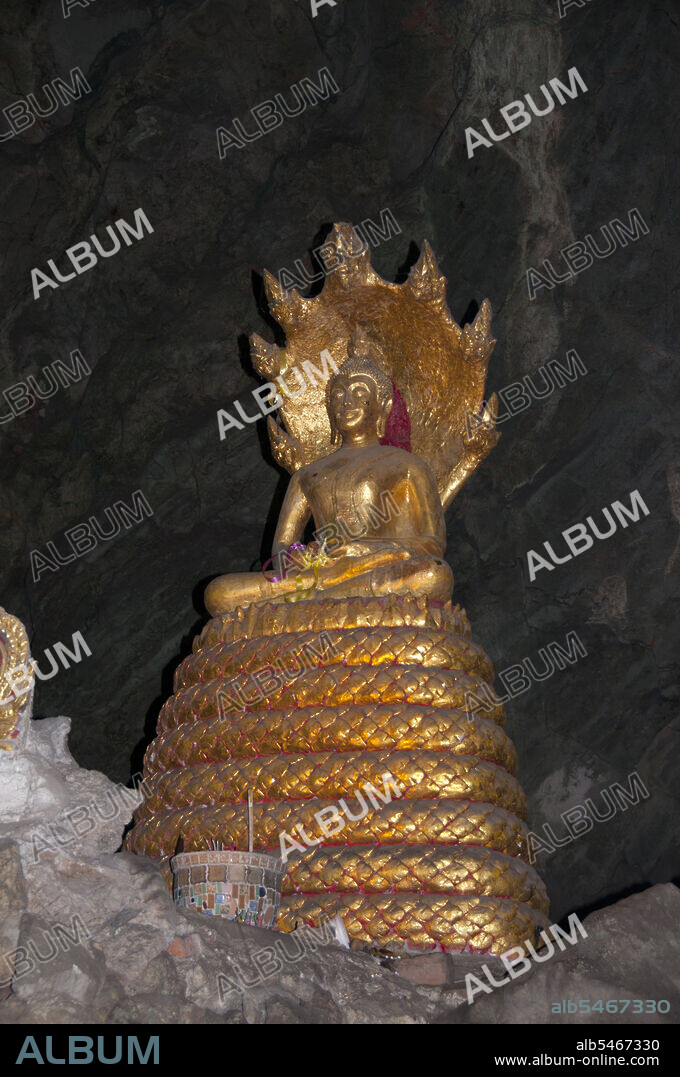 Tham Khao Luang is a large cave consisting of three linked chambers and is distinguished by many hanging stalactites and Buddha images, including a phra non or reclining Buddha. The main bronze image was cast on the orders of King Chulalongkorn (Rama V) and dedicated to his illustrious predecessors, Kings Rama III and Rama IV. There is a natural opening in the ceiling of the second, main chamber, through which daylight streams illuminating the images within.