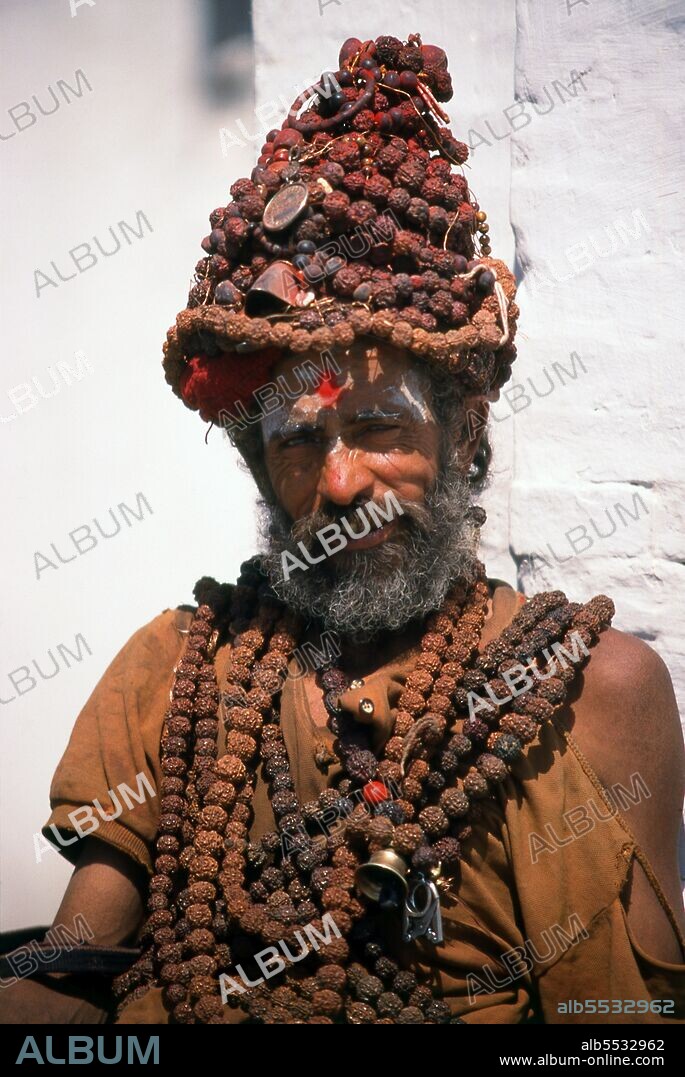 They are known, variously, as sadhus (saints, or 'good ones'), yogis (ascetic practitioners), fakirs (ascetic seeker after the Truth) and sannyasins (wandering mendicants and ascetics). They are the ascetic – and often eccentric – practitioners of an austere form of Hinduism. Sworn to cast off earthly desires, some choose to live as anchorites in the wilderness. Others are of a less retiring disposition, especially in the towns and temples of Nepal's Kathmandu Valley. If the Vale of Kathmandu seems to boast more than its share of sadhus and yogis, this is because of the number and importance of Hindu temples in the region. The most important temple of Vishnu in the valley is Changunarayan, and here the visitor will find many Vaishnavite ascetics. Likewise, the most important temple for followers of Shiva is the temple at Pashupatinath. Vishnu, also known as Narayan, can be identified by his four arms holding a sanka (sea shell), a chakra (round weapon), a gada (stick-like weapon) and a padma (lotus flower). The best-known incarnation of Vishnu is Krishna, and his animal is the mythical Garuda. Shiva is often represented by the lingam, or phallus, as a symbol of his creative side. His animal is the bull, Nandi, and his weapon is the trisul, or trident. According to Hindu mythology Shiva is supposed to live in the Himalayas and wears a garland of snakes. He is also said to smoke a lot of bhang, or hashish.