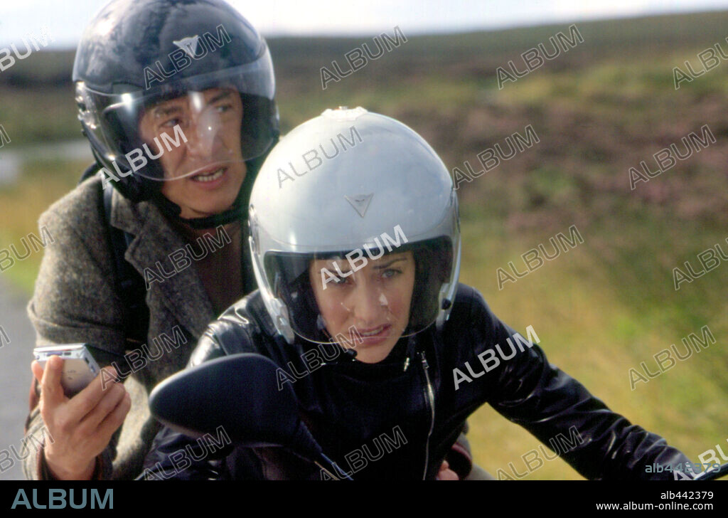 CLAIRE FORLANI and JACKIE CHAN in THE MEDALLION, 2003, directed by GORDON CHAN. Copyright TRI STAR PICTURES / TSUEN, CHAN KAM.