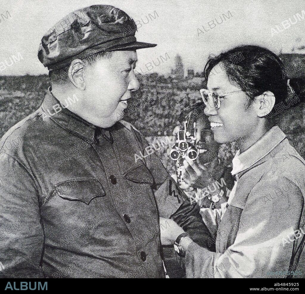 Chairman Mao with female Red Guard, during the Cultural Revolution. 1966. Mao Zedong (1893 - September 9, 1976), was a Chinese communist revolutionary who became the founding father of the People's Republic of China (PRC), which he ruled as the Chairman of the Communist Party of China from its establishment in 1949 until his death.