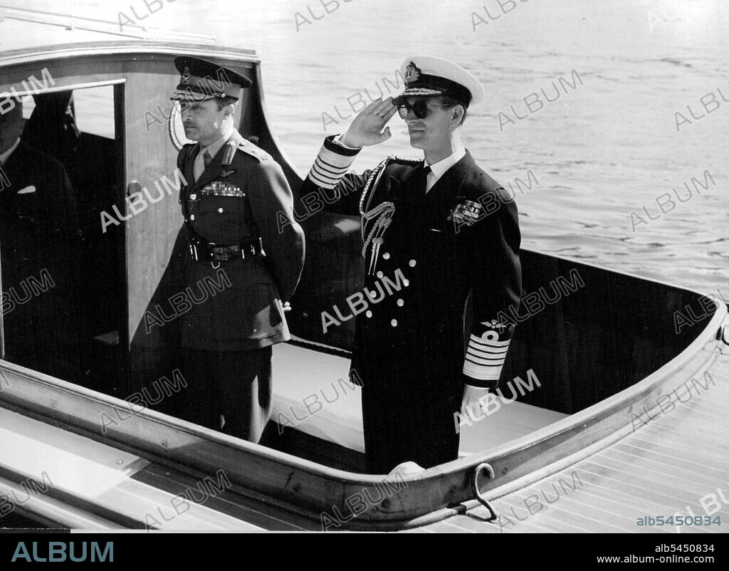 Duke of Edinburgh And The "Cutty Sark" -- The Duke of Edinburgh aboard the launch at Westminster pier. With him is Lt. Gen. Sir Frederick Browning.The Duke of Edinburgh sailed down the river Thames to-day from Westminster pier to greeenhithe the formally receive the famous old sailing clipper "Cutty Sark" on behalf of the Cutty Sark Preservation society of which the Duke is patron.the Clipper has been used for training cadets of the Thames Nautical Training college, H.M.S. Worcester, Since is was presented to the college in 1938. May 28, 1953. (Photo by Paul Popper).