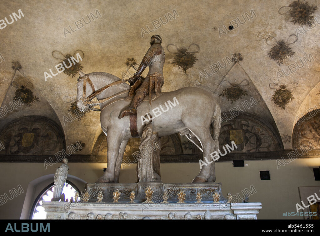 Milan, Lombardy, Italy, Europe. Sforza's Castle (Castello Sforzesco), was built in 15th Century by duke Francesco Sforza, is situated in the center of the city. Equestrian monument to Bernabò Visconti, marble statue of Bonino da Campione, built in 1363, "Museum of ancient art" of the castle.