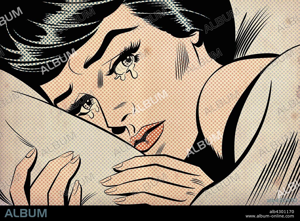 Woman crying in bed.