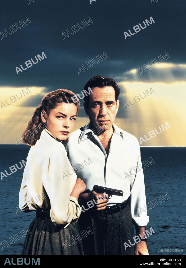 HUMPHREY BOGART and LAUREN BACALL in KEY LARGO, 1948, directed by JOHN HUSTON. Copyright WARNER BROTHERS.