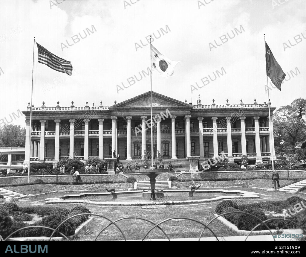 Seoul, South Korea: May 31, 1947. American, Korean and Russian flags fly from the Duk Soo Palace where the U.S.-U.S.S.R. Joint Commission on Korea is meeting.