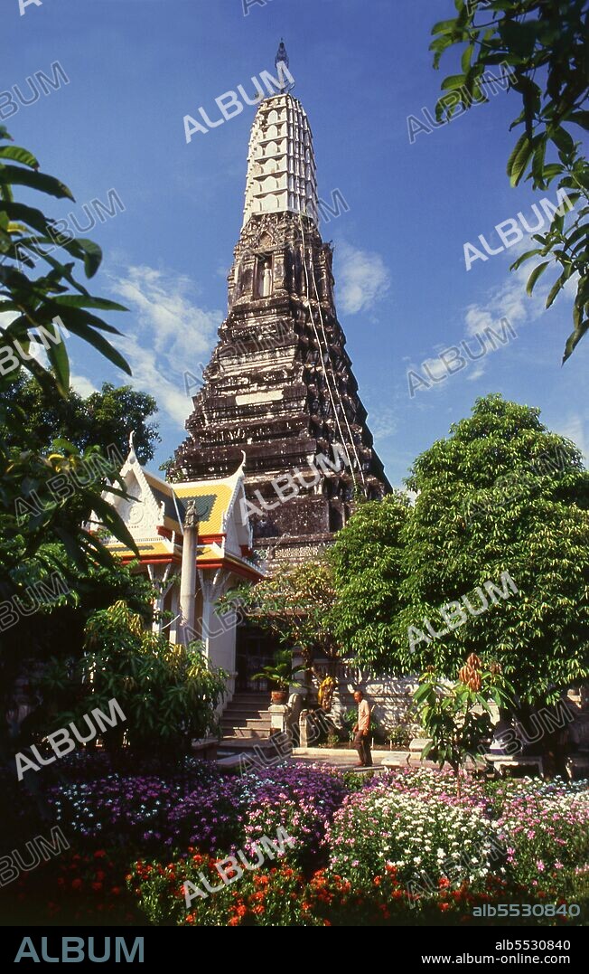 A prang is a tall tower-like spire, usually richly carved. They were a common shrine element of Hindu and Buddhist architecture in the Khmer Empire. They were later adapted by Buddhist builders in Thailand, especially during the Ayutthaya Kingdom (1350–1767) and Rattanakosin Kingdom (1782-1932). In Thailand it appears only with the most important Buddhist temples. Wat Chakkrawat is famous for its live crocodiles and also a small grotto containing what is called a Buddha shadow. Visitors press gold leaf on the shadow shape.