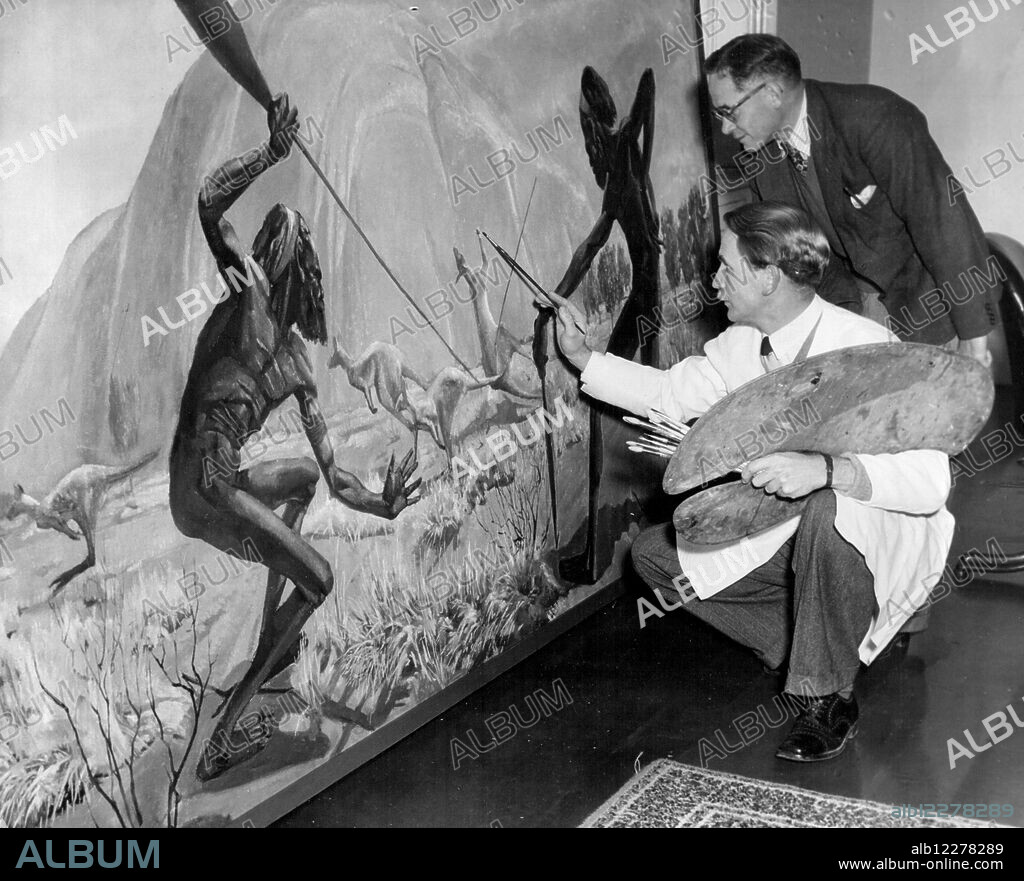 Artist J. Beeman, with the Curator of Anthropology Mr. McCarthy of the Museum work on the finishing touches to this picture of a Kangaroo hunt, near Ayres Rock, Central Australia - hung this week and the second of a new series of six. July 02, 1954.