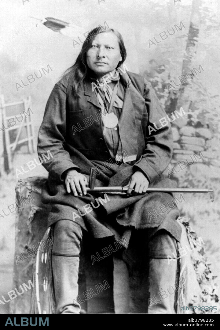 Spotted Elk holding peace pipe, no photographer credited, undated. Spotted Elk (1826 - December 29, 1890) was a chief of the Miniconjou, Lakota Sioux. He was considered a great man of peace, and was best known among his people for his political and diplomatic successes. During the 1870s, Spotted Elk allied his tribe against the US Army, together with half-brother Sitting Bull, cousin Crazy Horse and brother Touch the Clouds. When Sitting Bull was killed on Standing Rock Reservation, his followers fled for refuge at Spotted Elk's camp. Fearing arrest and government reprisals against his band, Spotted Elk led his band south to the Pine Ridge Reservation, at the invitation of Chief Red Cloud. He contracted pneumonia on the journey, surrendered peacefully and, with his band, was escorted to a campsite near Wounded Knee Creek. On the morning of December 29, 1890, Forsyth's soldiers entered the camp and demanded that the Lakota give up their weapons. A large gun fight quickly ensued and Spotted Elk was among those slain. The US forces killed 153 Lakota, mostly women and children in what became known as the Wounded Knee Massacre.