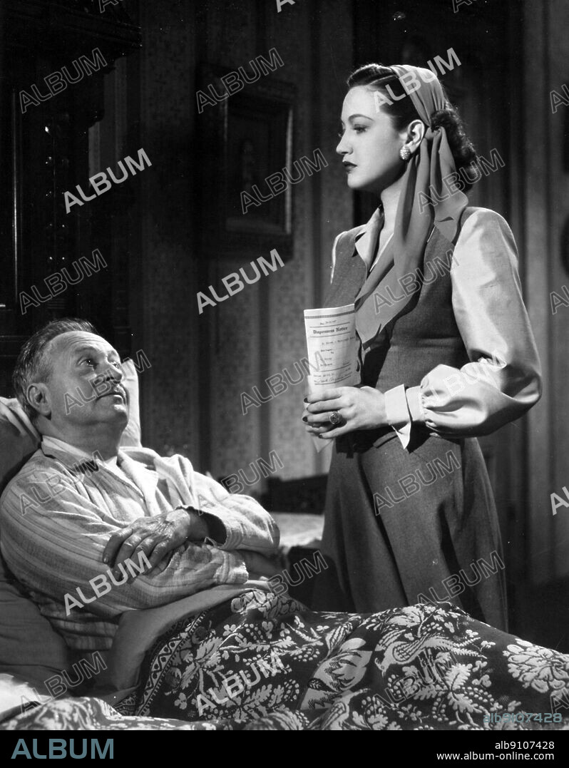 DOROTHY LAMOUR and ERNEST TRUEX in THE GIRL FROM MANHATTAN, 1948, directed by ALFRED E. GREEN. Copyright UNITED ARTISTS.