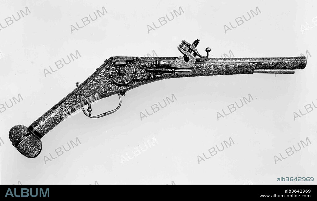 Wheellock Pistol. Culture: German, Augsburg. Dimensions: L. 20 3/8 in. (51.7 cm); L. of barrel 13 7/16 in. (34.1 cm); Cal. .492 in. (12.5 mm); Wt. 4 lb. 4 oz. (1928 g). Date: ca. 1560-70.
The sheathing of the stock in plaques of gilt copper with raised strapwork ornament is highly unusal but recalls clock cases, powder flasks, and other decorative metal objects made in Augsburg.