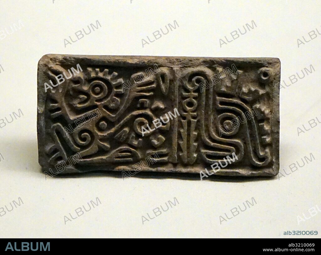 Fragment of Aztec stone box bearing the image of a water opossum. Dated 14th Century.