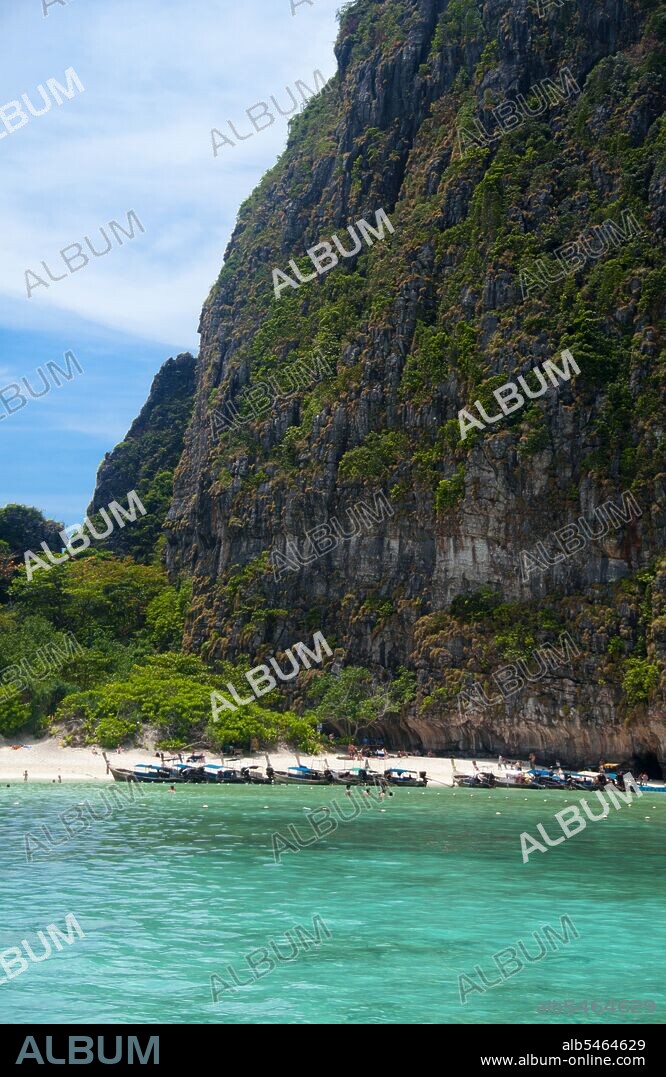 Ko Phi Phi consists of two islands, Phi Phi Leh and Phi Phi Don, located southeast of Phuket. Both are part of Hat Noppharat Thara Ko Phi Phi National Marine Park. Set in the centre of the Sea of Phuket, Ko Phi Phi is almost equidistant from Phuket and Krabi and can be reached by boat in around two hours. Phi Phi Don is the larger of the two islands, with scenic hills, steep cliffs, silken beaches, azure waters and remarkable bird- and sea-life. The island narrows at the middle where long, white-sand beaches are only a few hundred metres apart. Boats from Krabi and Phuket dock at Ao Ton Sai on the southern side of the island. Hat Yao or 'Long Beach' faces south and is famous for the good snorkelling to be had on its coral reefs. To the northeast Hat Lanti is another fine beach with good waves for surfing. North of this beach is beautiful Ao Bakao, a bay with a small resort, while near the tip of Laem Tong are three more luxury resorts.