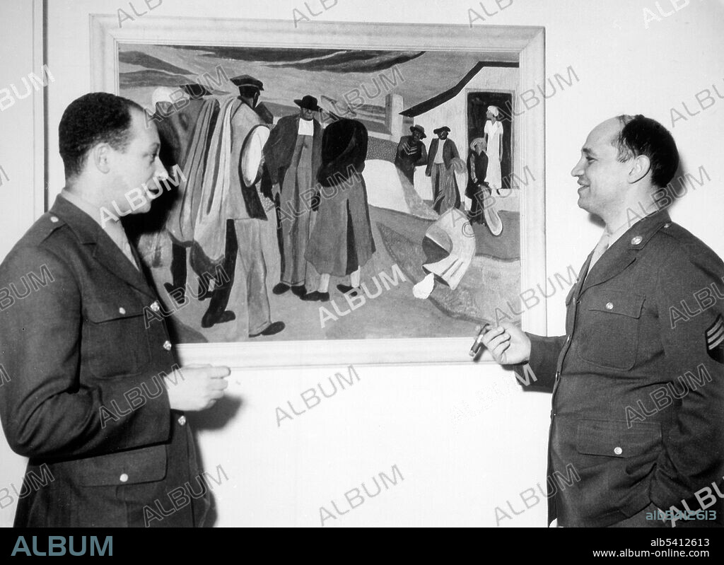 Sgt. Bearden (right) discussing one of his paintings, Cotton Workers, with Pvt. Alston, his first art teacher and cousin. Bearden and Alston were members of the 372nd Infantry Regiment stationed in NYC. Romare Bearden (September 2, 1911 – March 12, 1988) was an African-American artist. He worked with many types of media including cartoons, oils and collages. He began his artistic career creating scenes of the American South. Charles Henry Alston (November 28, 1907 - April 27, 1977) was an American painter, sculptor, illustrator, muralist and teacher who lived and worked in the NYC neighborhood of Harlem. Alston was active in the Harlem Renaissance and was the first African-American supervisor for the Works Progress Administration's Federal Art Project. Carl Van Vechten, April 15, 1944.