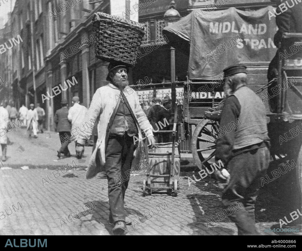 Fish porters at Billingsgate Market, London, 1893. London's main fish market, Billingsgate Market became established on Billingsgate Wharf during the 16th century. It moved to a new location near Canary Wharf in 1982.