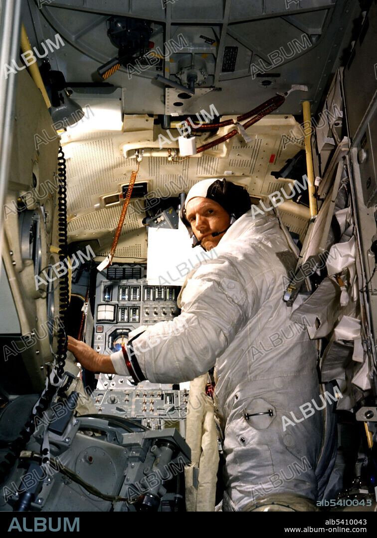 Neil Armstrong, commander for the Apollo 11 moon-landing mission, practices for the historic event in a lunar module simulator in the Flight Crew Training Building at Kennedy. Apollo 11 was the spaceflight that landed the first two people on the Moon. Commander Neil Armstrong and lunar module pilot Buzz Aldrin landed the Apollo Lunar Module Eagle on July 20, 1969. Armstrong became the first person to step onto the lunar surface six hours later on July 21; Aldrin joined him 19 minutes later. They spent about two hours together outside the spacecraft, and collected 47.5 pounds of lunar material to bring back to Earth. Command module pilot Michael Collins flew the command module Columbia alone in lunar orbit while they were on the Moon's surface. Armstrong and Aldrin spent 21.5 hours on the lunar surface before rejoining Columbia in lunar orbit.