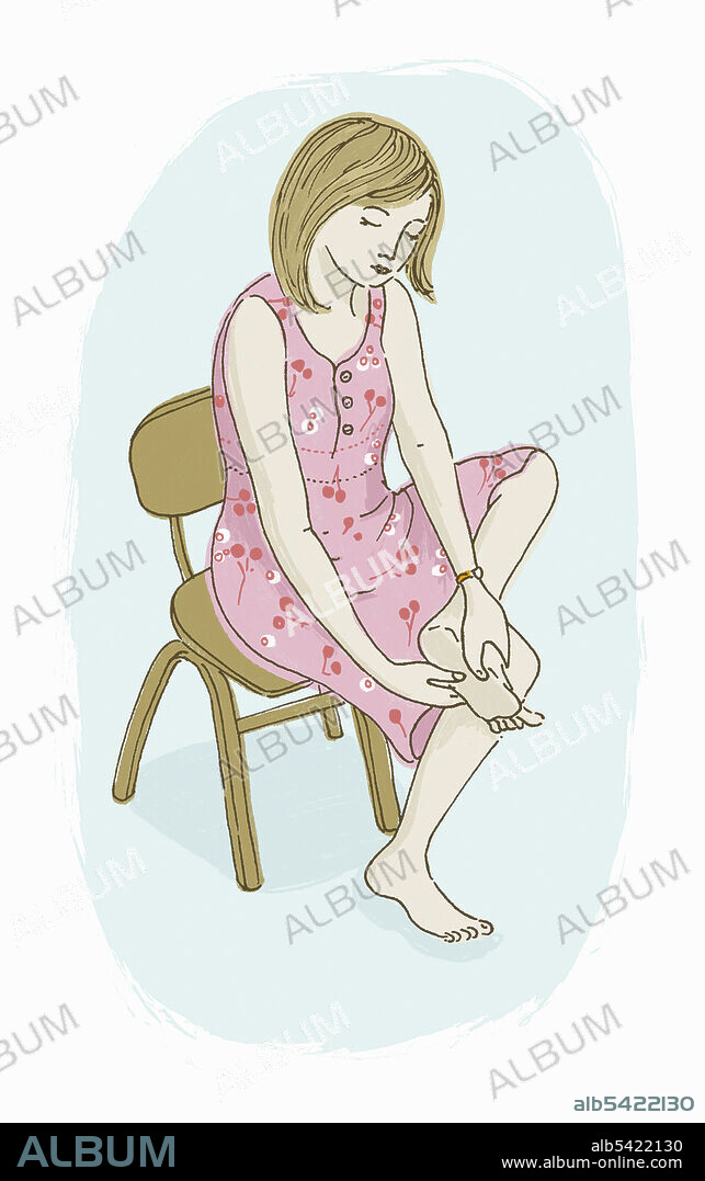 Woman massaging her own foot.