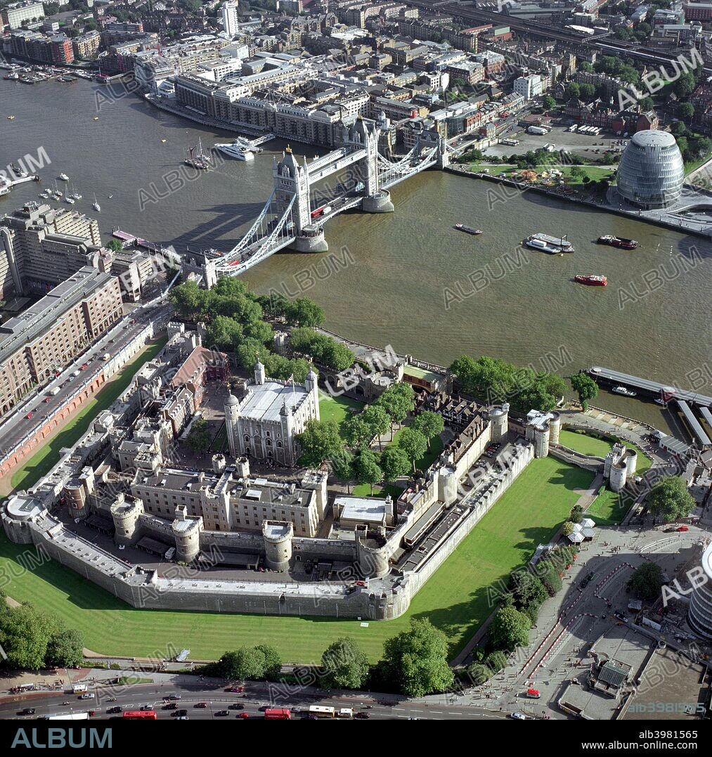 Tower of London, Tower Bridge and City Hall, London, 2000s. Aerial view. The new City Hall, headquarters of the Greater London Authority, designed by Foster & Partners, 1998-2002, stand across the River Thames from the Tower of London, from which the country was governed for so long during the medieval period.