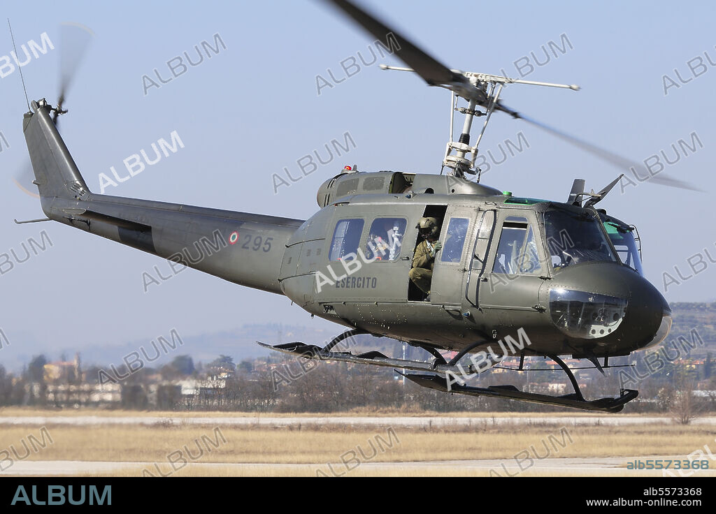 An Italian Army AB-205 helicopter taking off for a training mission over Italy.