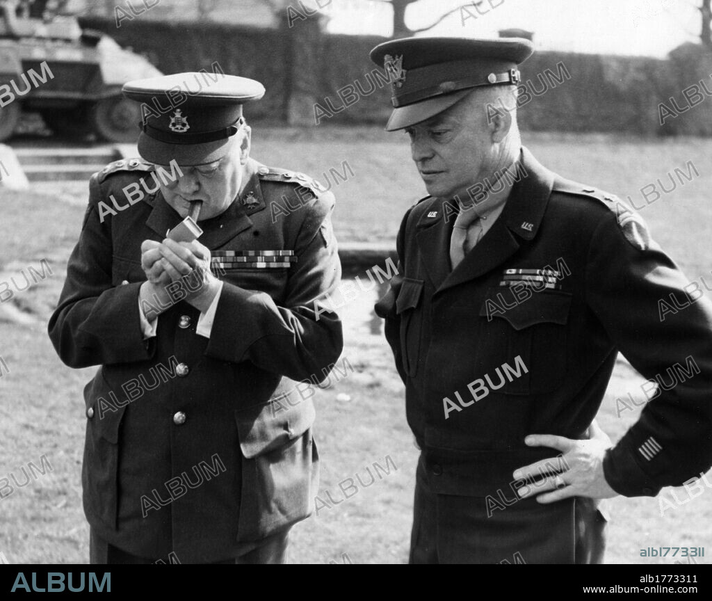 Winston Churchill with Dwight Eisenhower. British Prime Minister Winston Churchill lighting a cigar while staying at the Allied Headquarters with U.S. General Dwight David Eisenhower. France, March 1945.