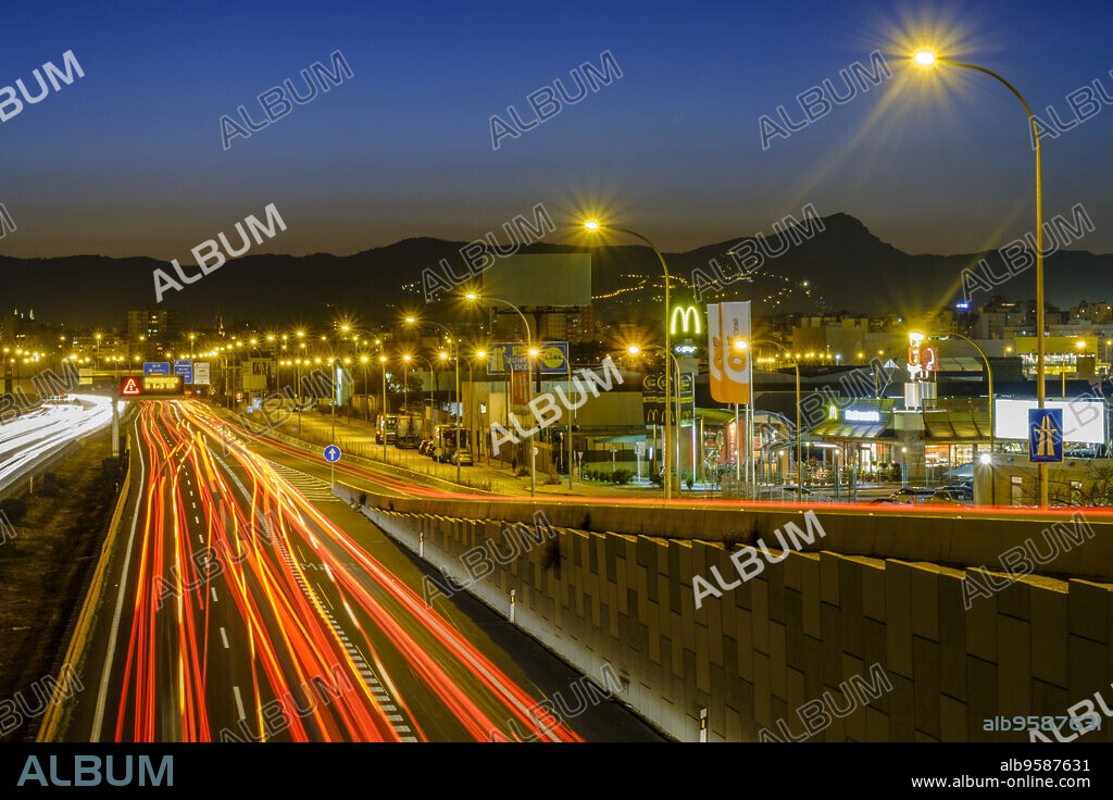 Nighttime vehicle lights on La-19, Levante Highway, Palma, Mallorca, Balearic Islands, Spain, Europe.