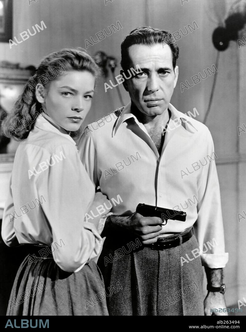 HUMPHREY BOGART and LAUREN BACALL in KEY LARGO, 1948, directed by JOHN HUSTON. Copyright WARNER BROTHERS.