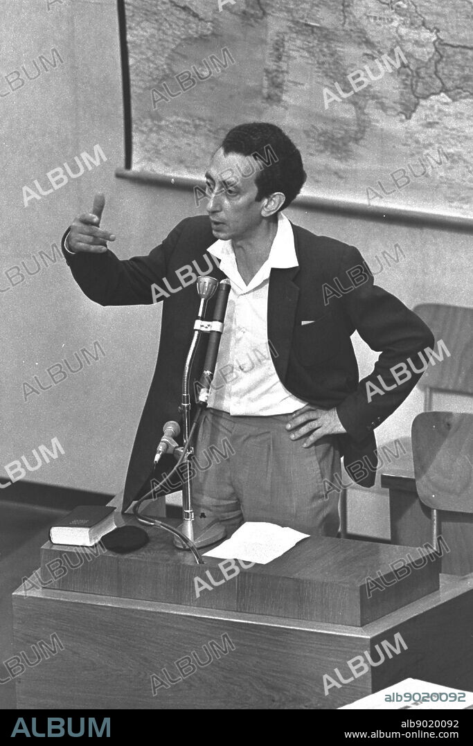 Abba Kovner (1918 1987) Jewish Hebrew poet, writer and partisan leader as a witness at the Adolf Eichmann trial in Jerusalem, 1961. He became one of the great poets of modern Israel. in 1940, Vilnius was given to Lithuania after Nazi Germany and the Soviet Union invaded and divided Poland. After occupation established the Vilna Ghetto. Kovner managed to escape .From September 1943 until the arrival of the Soviet army in July 1944, Kovner, commanded a partisan group called the Avengers ('Nokmim') in the forests near Vilna Abba Kovner testifying at the trial of Adolf Eichmann.