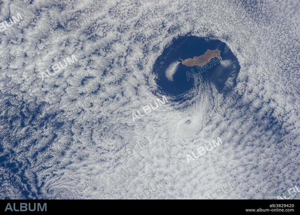 From an altitude of 223 nautical miles, one of the Expedition 40 crew members on the International Space Station photographed this nearly vertical image of Guadalupe Island and the Von Karman cloud vortices that neighbor it just off southern California's Pacific Coast.