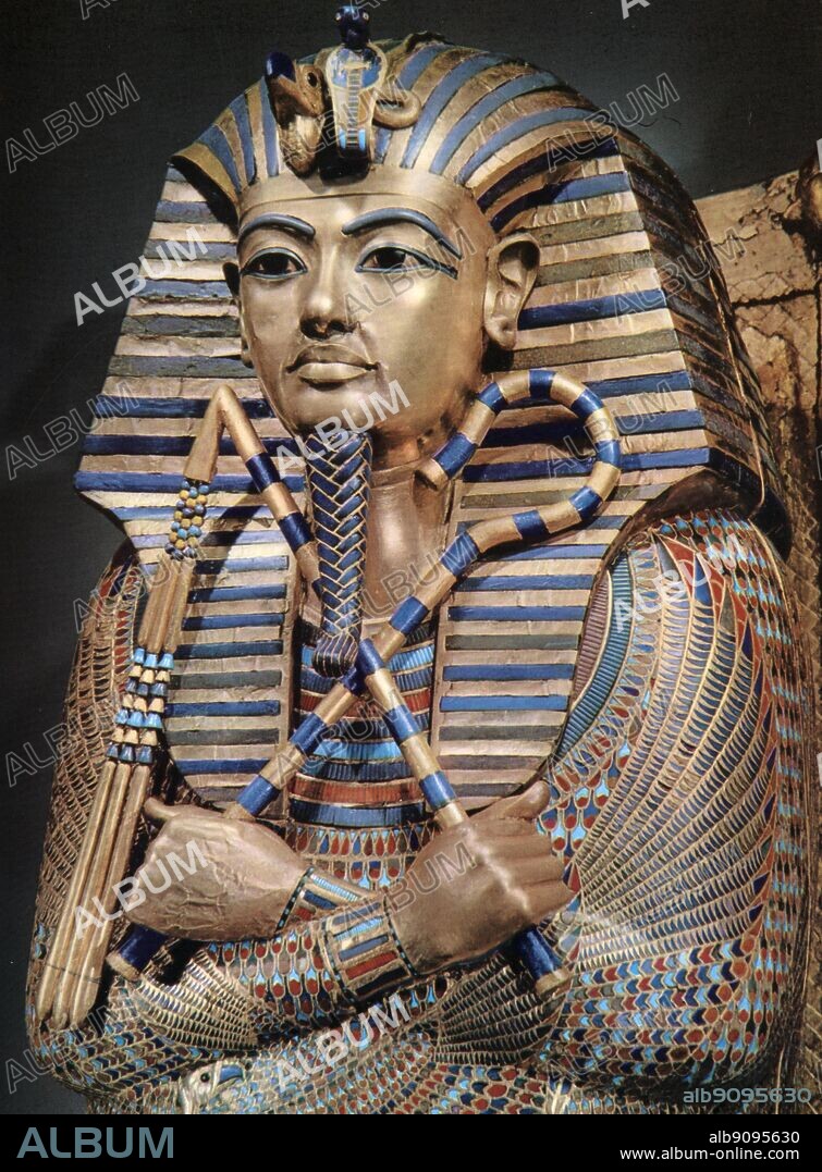 Detail of the second mummiform coffin. Gold plated wood inlaid with glass-paste. Tukankhamen, by Christiane Desroches Noblecourt, page 267..  The Egyptologist Howard Carter (employed by Lord Carnarvon) discovered Tutankhamun's tomb (since designated KV62) in The Valley of The Kings on November 4, 1922 near the entrance to the tomb of Ramses VI. Carter contacted his patron, and on November 26 of that year both men became the first people to enter Tutankhamun's tomb in over 3000 years. After many weeks of careful excavation, on February 16, 1923 Carter opened the inner chamber and first saw the sarcophagus of Tutankhamun..  The sarcophagus contained three gold coffins nested within each other. Inside the final one was the mummy of the boy-king, Pharaoh Tutankhamen.