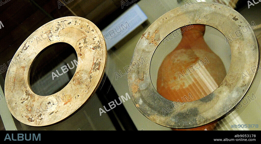 Two jade discs, bi Shang dynasty, 12th-11th century BC.