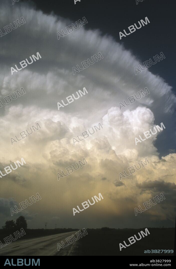 Cumulonimbus clouds and a severe thunderstorm erupt over southern Manitoba, Canada. Cumulonimbus clouds are composed of water droplets and ice crystals, evolving from the further development of cumulus congestus.