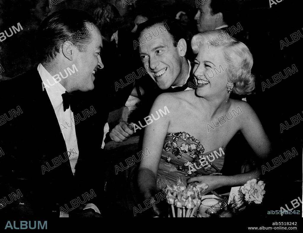 Comic To Comic. Tommy Trinder exchange a joke with Bob Hope (left), who, with Marilyn Maxwell, celebrated with a party attended by 50 guests after their opening show in London. After their opening show last night Bob Hope (left) and Marilyn Maxwell celebrated with a party attended by 50 guests, among them Tommy Trinder, seen exchanged a joke with Bob. April 24, 1951.