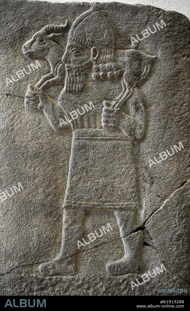 Hittite art. Orthostat. 8th century BC. Relief: Man carrying a gazelle.  Found in old city of Sma'al /Zincirli (Turkey). 775 BC. Pergamon Museum. Museum Island. Berlin. Germany.