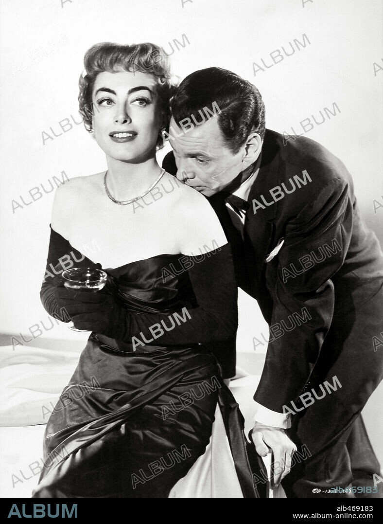 BARRY SULLIVAN and JOAN CRAWFORD in QUEEN BEE, 1955. Copyright COLUMBIA PICTURES.