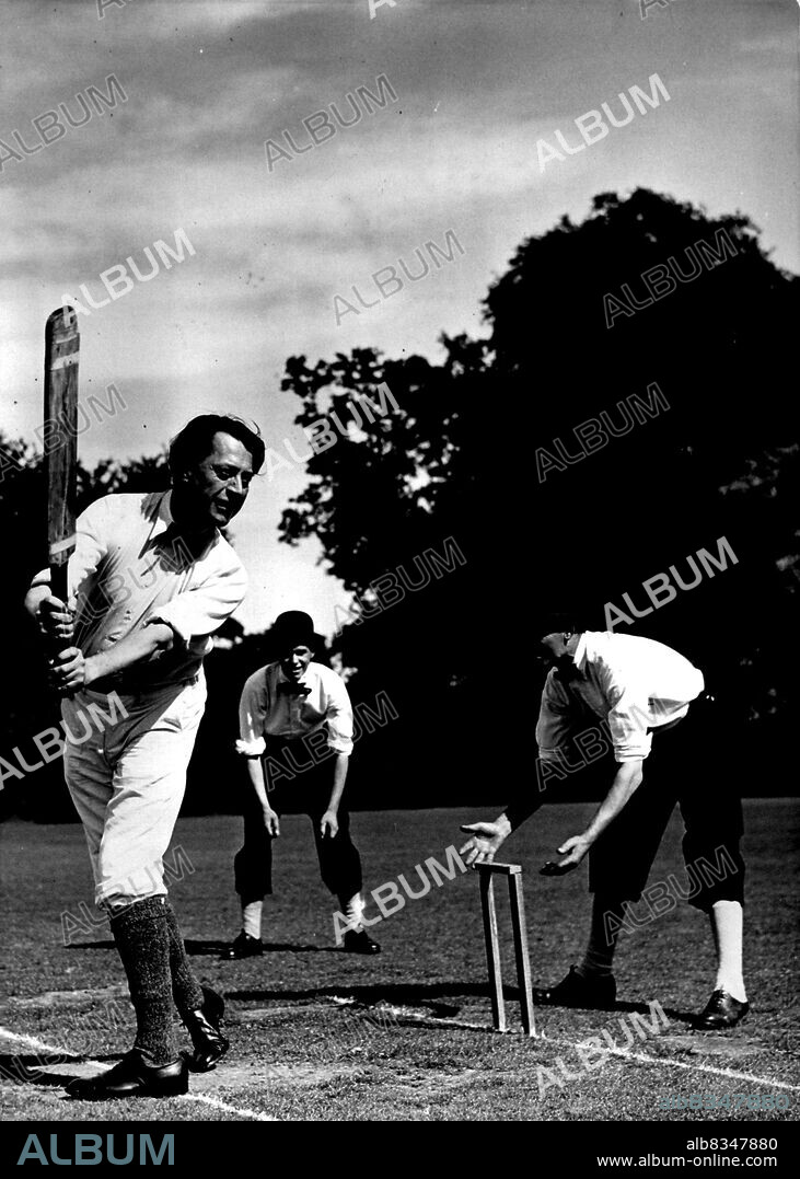 Batting Back 200 Years -- Mr. John Moore, the well-known author batting for the Gentlemen in the 200- year-old cricket match.A team of Professor A.H. Smith's Gentlemen met the Dumbleton C.C. In a cricket match at the village of Dumbleton, near Tewkesbury, played according to the rules of 1751. Two stumps only were used, bowling was underhand, the players wore knee breeches, and the umpire was supplied with a bat. August 22, 1951. (Photo by Fox Photos).