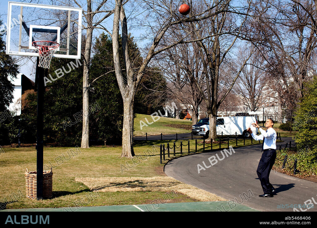 President Barack Obama shoots hoops on the White House South Lawn basketball court 3/6/09..