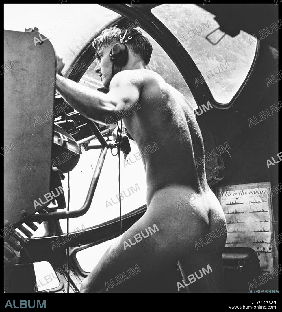 Photograph of a nude crewman of a US Navy rescue mission after jumping into the Harbor to rescue Marine pilots shot down while bombing Japanese fort. Dated 1944.