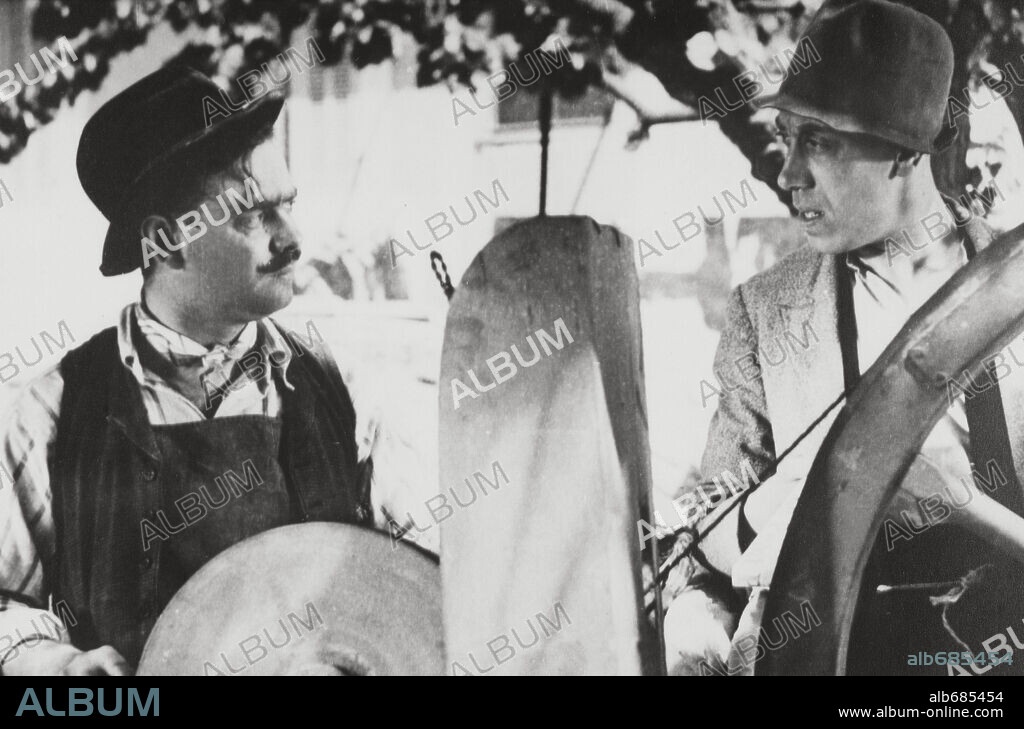FERNANDEL and ORANE DEMAZIS in ANGÈLE, 1934, directed by MARCEL PAGNOL. Copyright LES FILMS MARCEL PAGNOL.