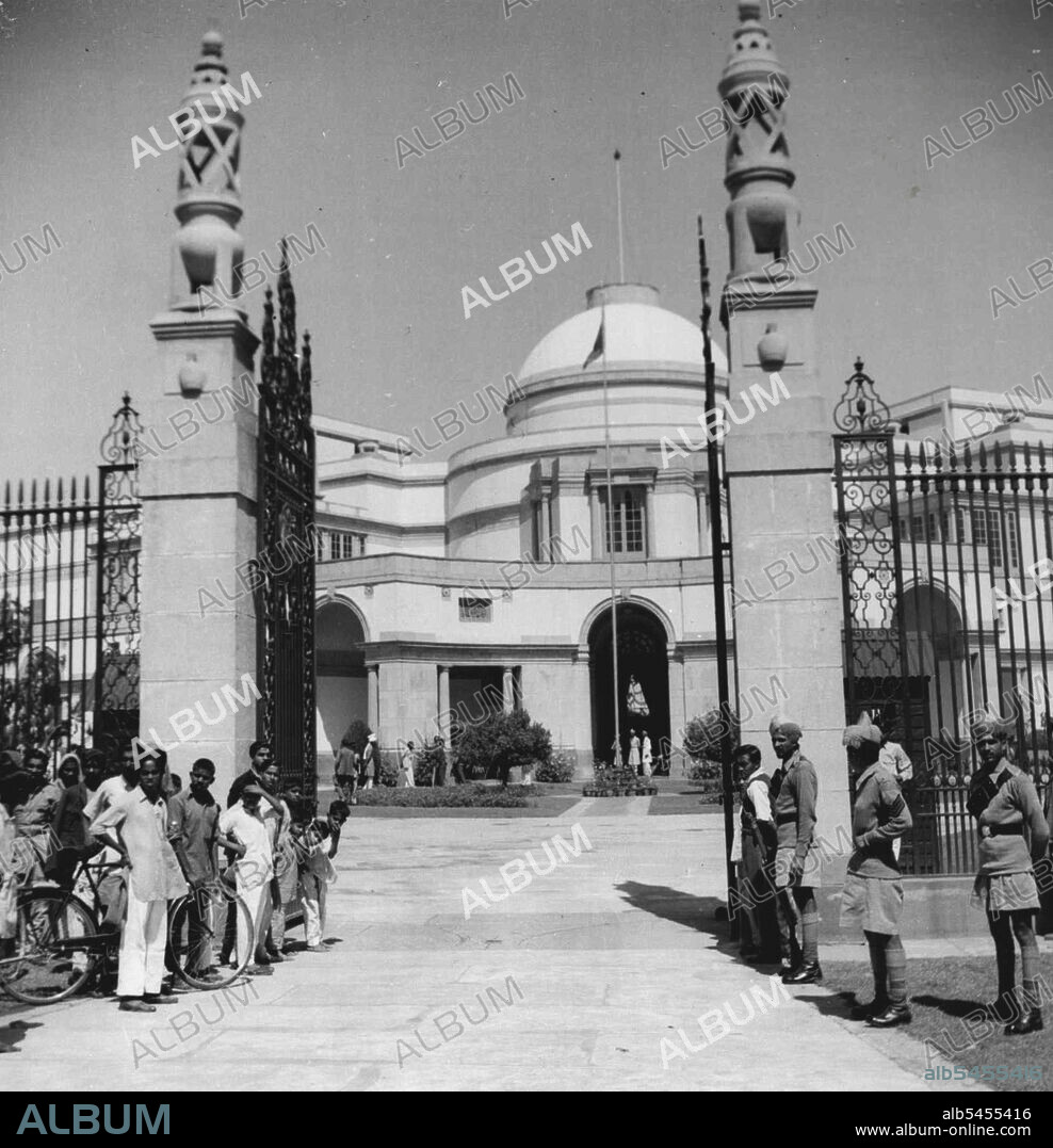 Nizam (Richest Man In World) Visits New Delhi. First In 16 Years - Guards stand on duty at Hyderabad House, New Delhi, where the aged Nizam of Hyderabad, making his first visit to New Delhi for over 16 years, is in residence. His flag flies at the flagstaff.The Nizam, richest man in the world., who owns an aviation company, chartered a Constellation plane for the trip. He was accompanied by two wives and a number of children. Under the new constitution the Nizam is the Governor of the State of Hyderabad. He is visiting the capital to attend the Governors' Conference. March 17, 1952.