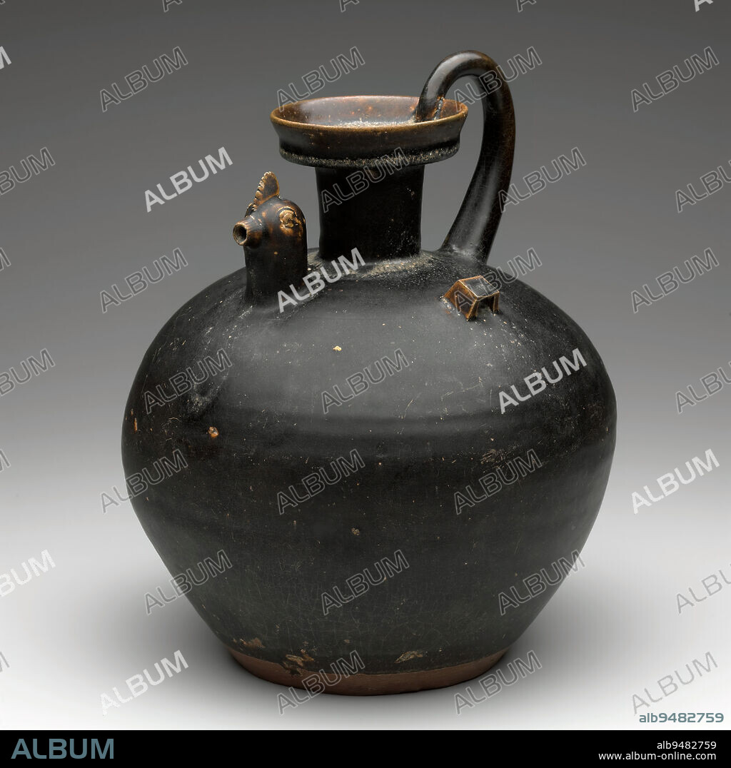 Chicken-Head Ewer, 4th century, 12-3/8 x 9-7/8 x 9-7/8 in. (31.4 x 25.1 x 25.1 cm), Yue ware Stoneware with dark brown glaze, China, 4th century, Curious 'chicken-head' spouts appear on a relatively large group of 4th century celadon and brown glazed wares produced at the yue kilns in South China. The sculptural spouts had no symbolic importance and likely evolved from late Zhou dynasty bronze ewers.