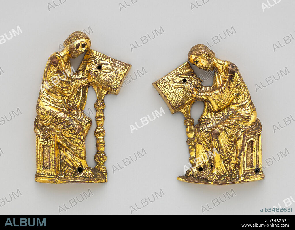Evangelists Mark and Luke, ca. 1220–30, Made in Limoges, France, French, Gilded copper and glass, Overall (Mark .1): 6 7/8 x 4 7/16 x 1 1/4 in. (17.4 x 11.2 x 3.1 cm), Metalwork-Copper, Intent on their work, Saints Mark and Luke pen extraordinary messages based in medieval theology rather than the text of their gospels. Mark links belief in the Resurrection of Jesus to the medieval legend that the lion breathes life into stillborn cubs three days after their birth.