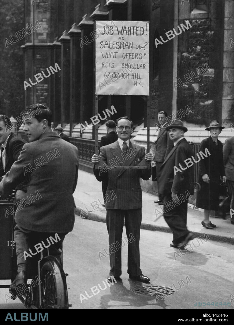 "Selling Himself" -- Mr. Arthur Clements 38 of Finsbury Park, North London, is an expert salesman, with one of the chief qualifications that such a job demands, the ability to "sell himself"..... In fact, when Britain's boosted expert trade did him out of his pre-war door-to-door sales, that's just what he did! Here he is selling himself" near London's West End. He had crept out with his home-made board, (adapted from a wooden blackout frame), while his wife was out shopping. August 2, 1946. (Photo by Mirror Features).