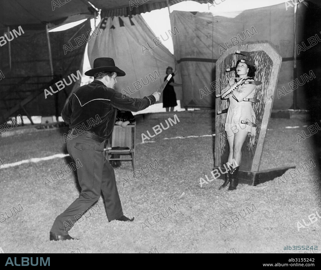 Venice, California:  1945 Tex and Alice Orton practicing their knife throwing exhibition.