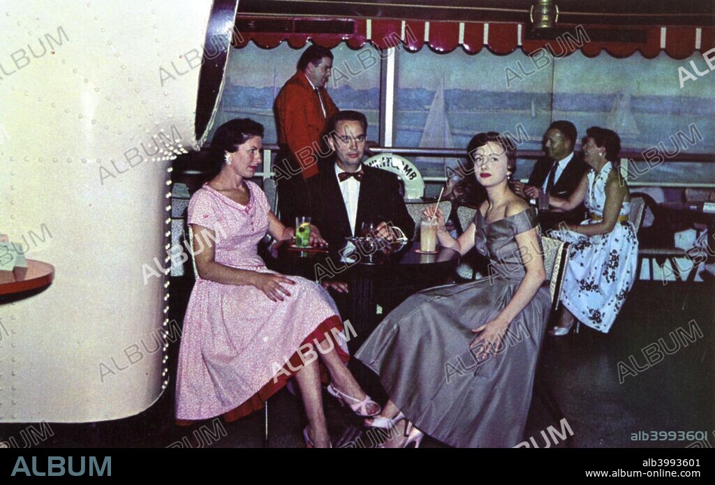 Marine Bar, Whitcomb Sulphur Springs Hotel, St Joseph, Michigan, USA, 1955. Customers sit around tables enjoying cocktails in a ship-like setting.